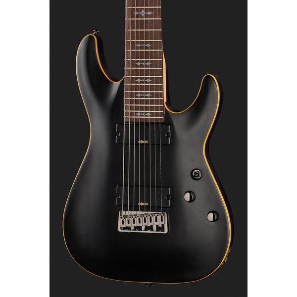 La guitare électrique Schecter Demon-8 Aged Black Satin - Avis et Test